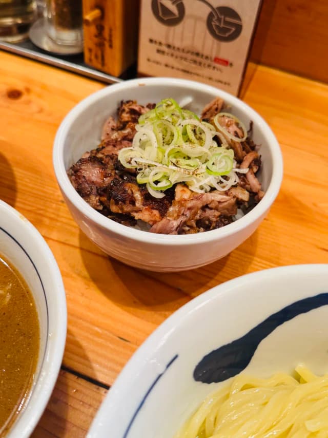 The soup base is neither soy sauce nor salt, but a French-style broth made from chicken, duck, and Italian cured ham.