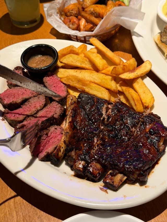 Don't let the dark color fool you; these fall-off-the-bone pork ribs are unbelievably delicious, coated in a tangy-sweet sauce you can't get enough of!